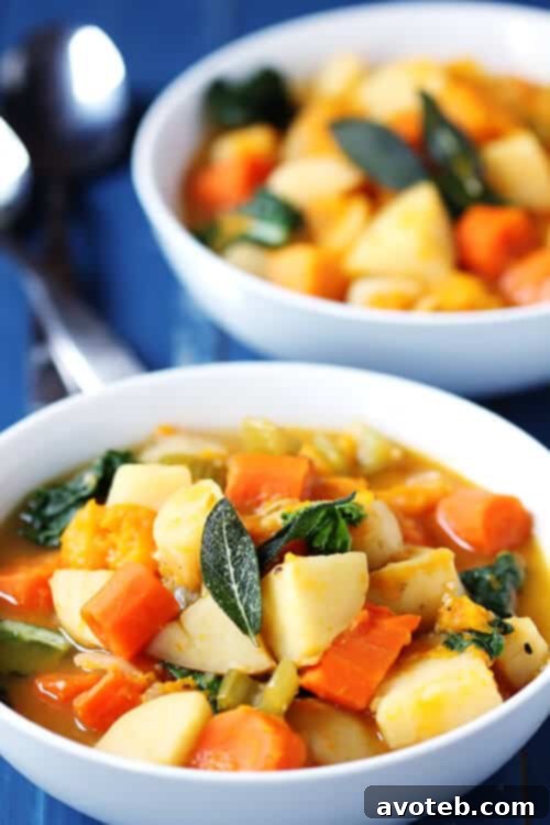 Slow Cooker Root Vegetable Stew (Gimme Some Oven) A bowl of hot Slow Cooker Root Vegetable Stew with a spoon