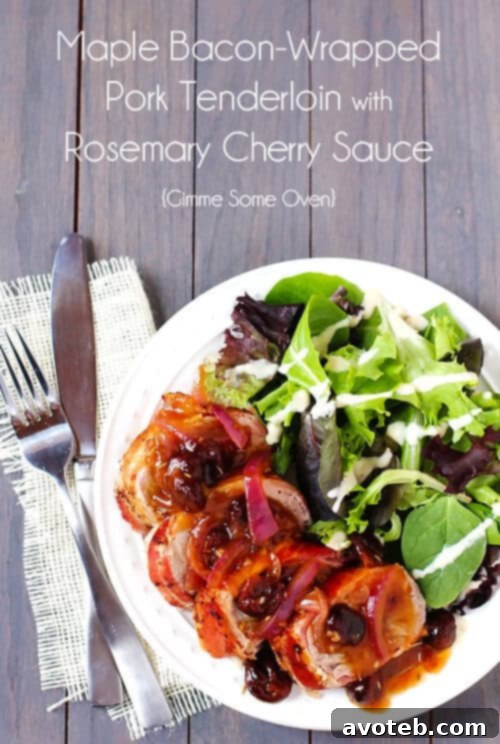 Maple Bacon-Wrapped Pork Tenderloin with Rosemary Cherry Sauce | gimmesomeoven.com Maple Bacon-Wrapped Pork Tenderloin with Rosemary Cherry Sauce served on a platter, ready to be enjoyed.