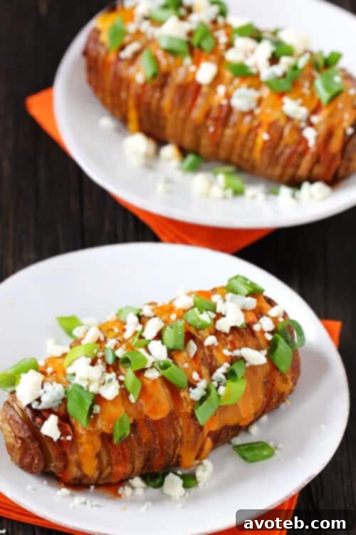 Serving Buffalo Hasselback Potatoes Buffalo Hasselback Potatoes garnished with blue cheese and green onions