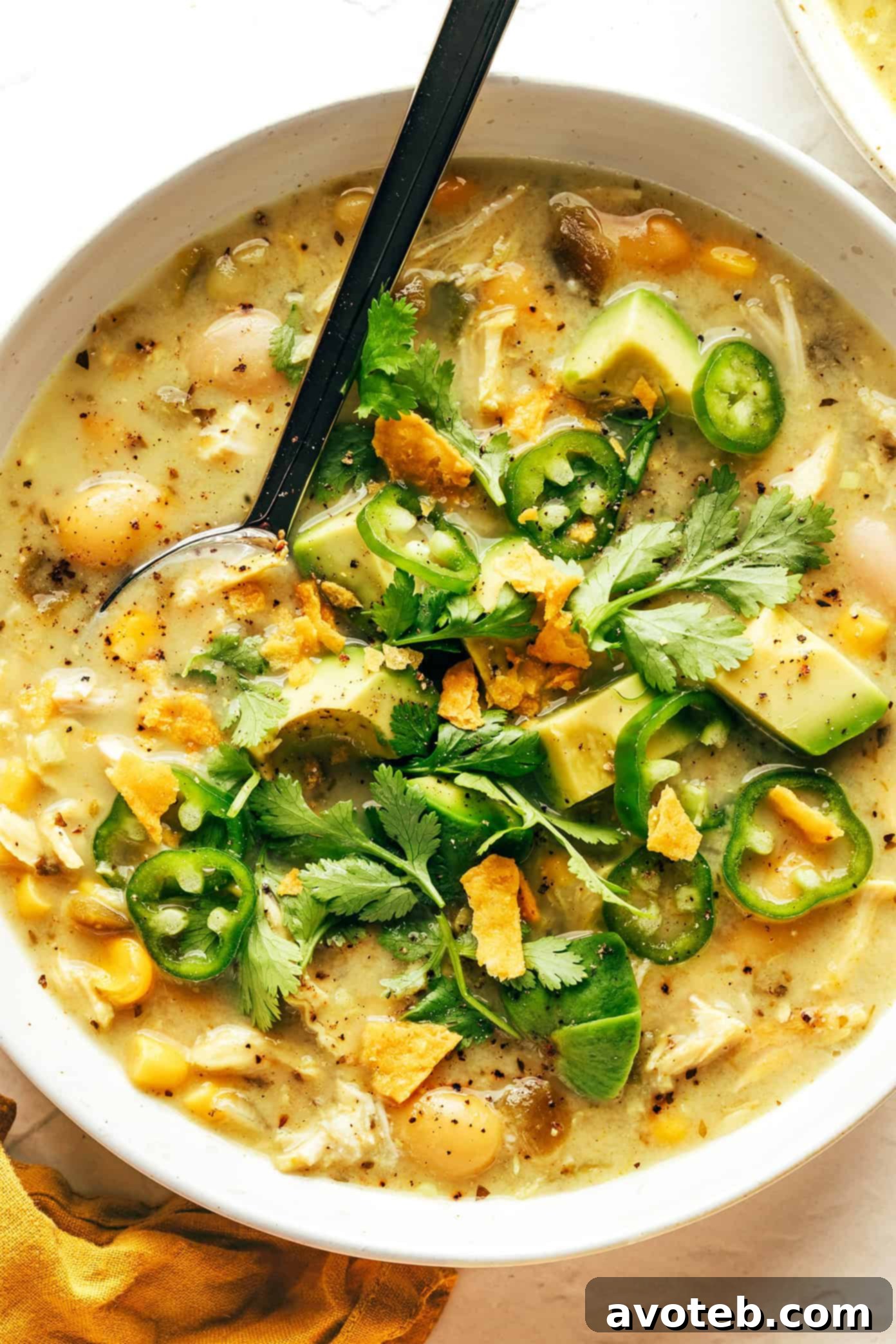 A full bowl of white chicken chili, ready to be eaten.