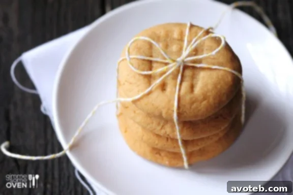 3 Ingredient Peanut Butter Cookies Recipe | gimmesomeoven.com Delicious 3-Ingredient Peanut Butter Cookies on a baking sheet