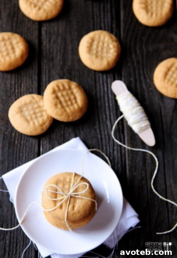 3 Ingredient Peanut Butter Cookies Recipe | gimmesomeoven.com Plate of freshly baked 3-ingredient peanut butter cookies