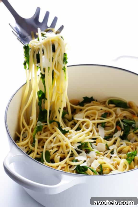A freshly served bowl of Linguine with Arugula, Garlic, and Parmesan, garnished for presentation