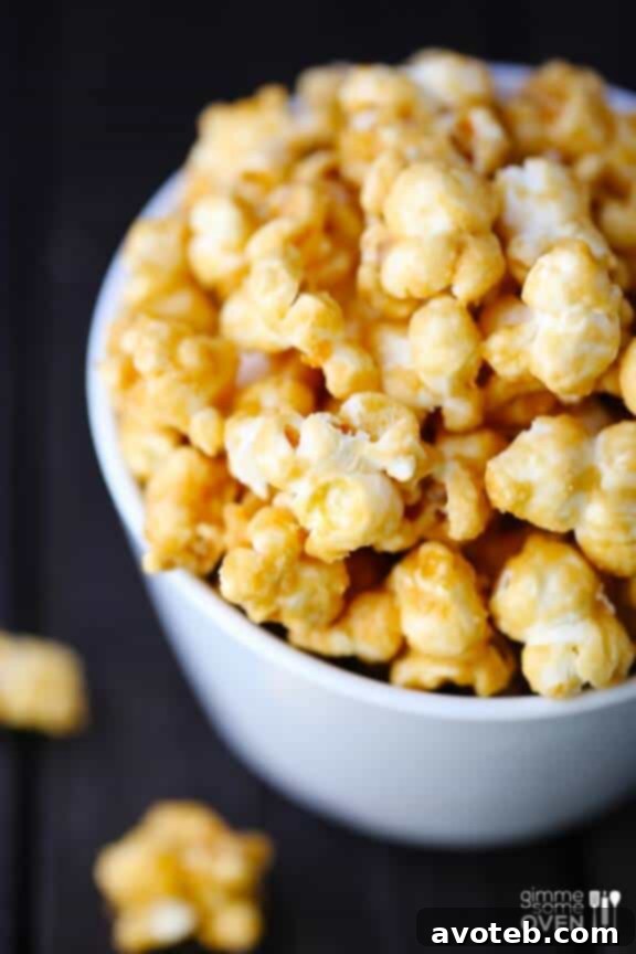 A close-up shot of crispy, golden Homemade Caramel Corn glistening with caramel