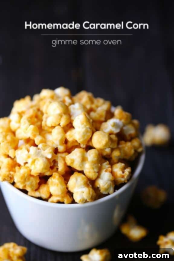 A bowl of Homemade Caramel Corn with a hand reaching for a piece, highlighting its inviting texture