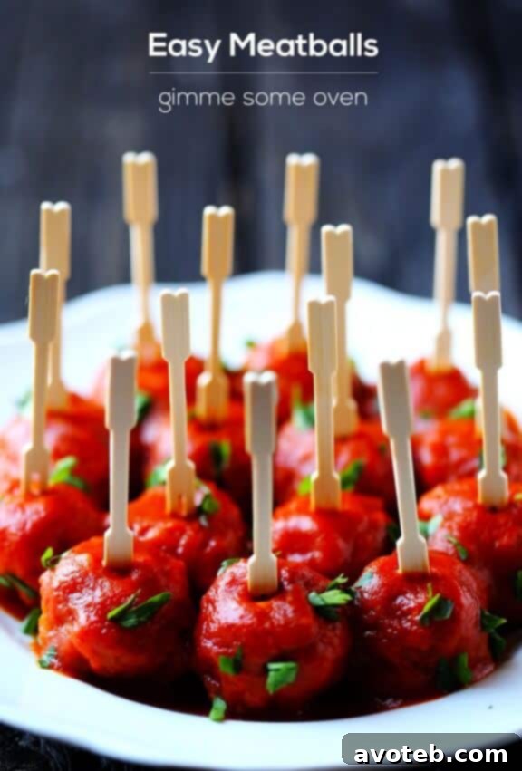 Close-up of a meatball with smoky sauce and fresh basil