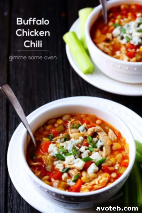 Buffalo Chicken Chili with a spoon and toppings