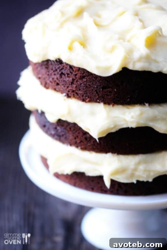 Decadent Guinness Chocolate Cake with Cream Cheese Frosting 5 Sliced Guinness Chocolate Cake on a Cake Stand