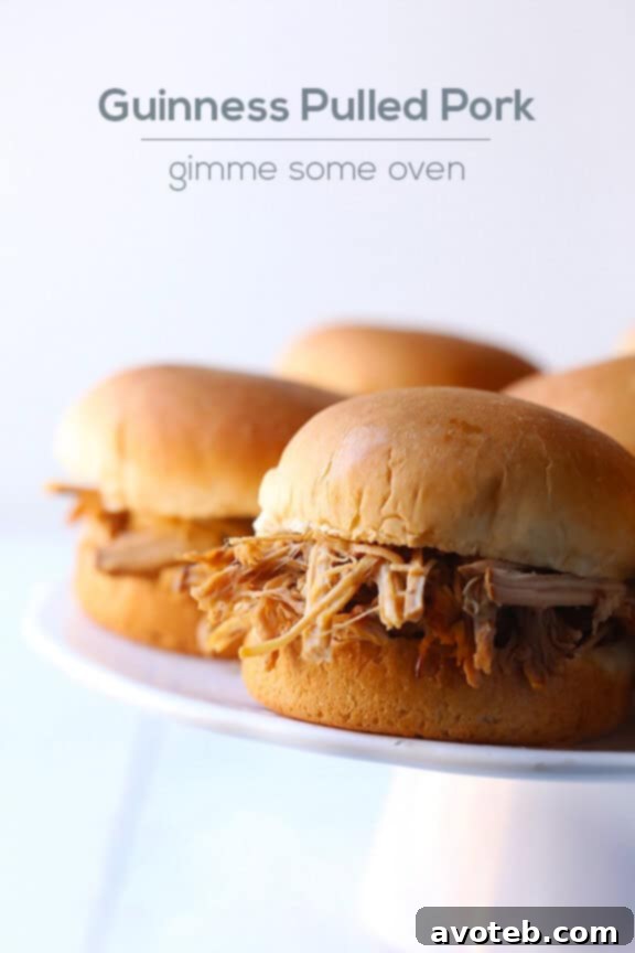 Overhead shot of Guinness Pulled Pork sliders and side dishes