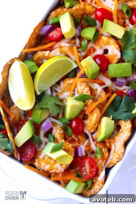 Loaded Cheesy Pretzel Nachos with various fresh toppings
