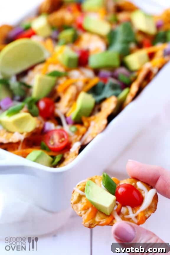 Overhead view of a baking dish filled with Loaded Cheesy Pretzel Nachos
