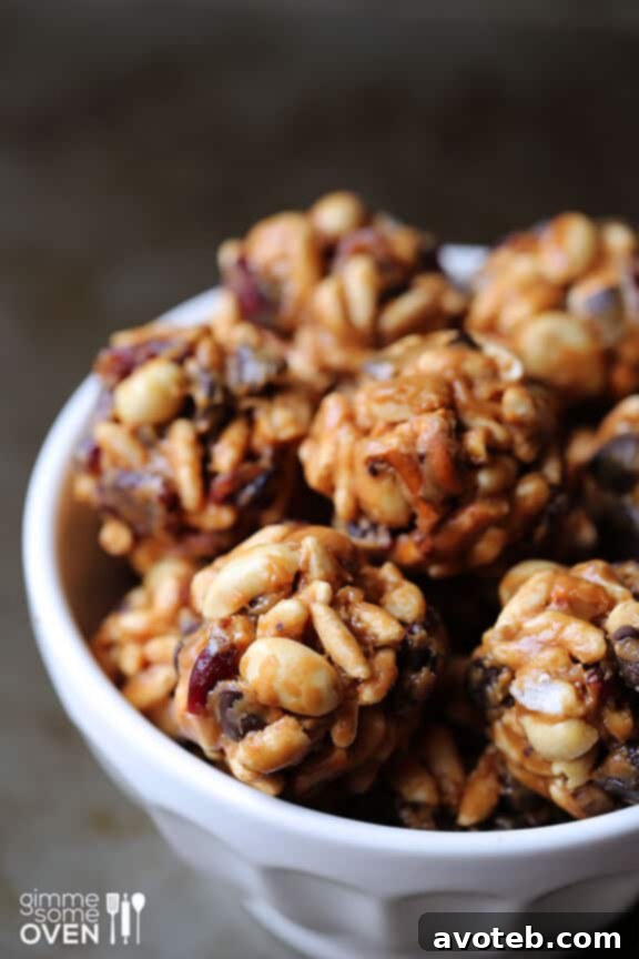 Shaping the Trail Mix Energy Bites into small, uniform balls.