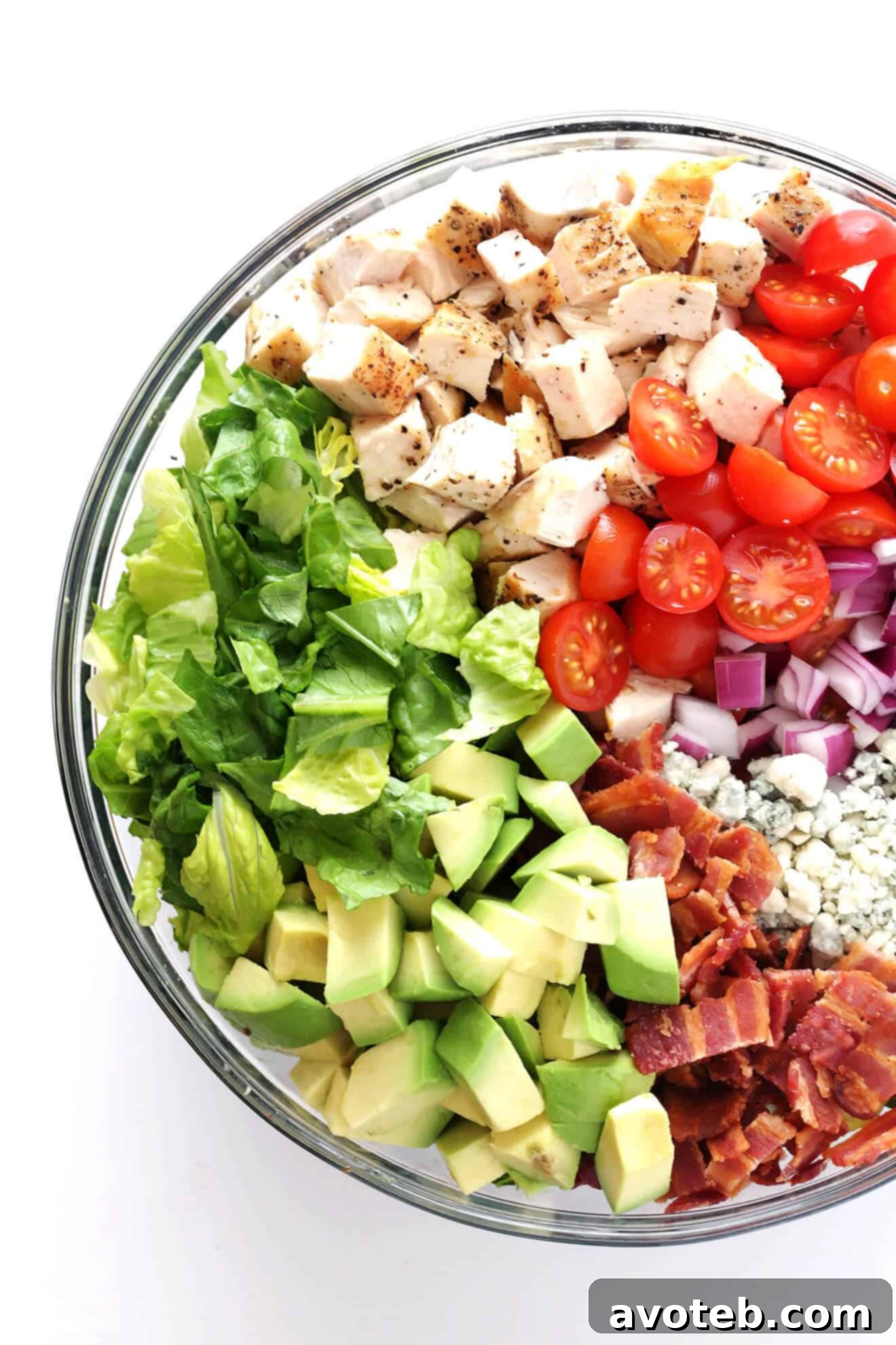 This Chicken, Bacon and Avocado Chopped Salad is made with the most delicious savory ingredients, including lots of blue cheese and a yummy red wine vinaigrette. | gimmesomeoven.com