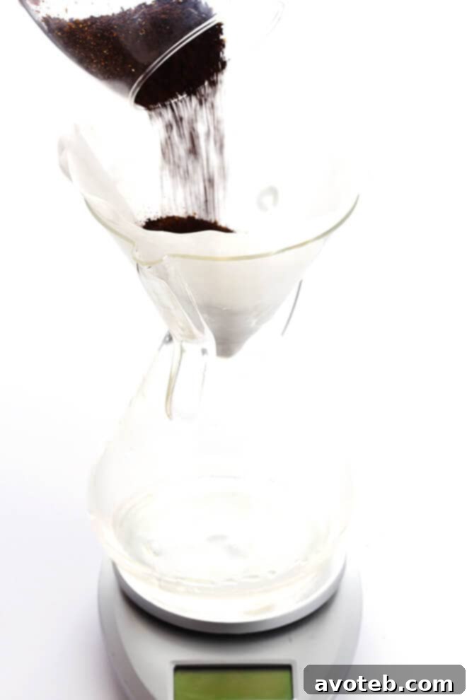 Step 2: Rinse the coffee filter thoroughly and preheat your pour-over brewer.