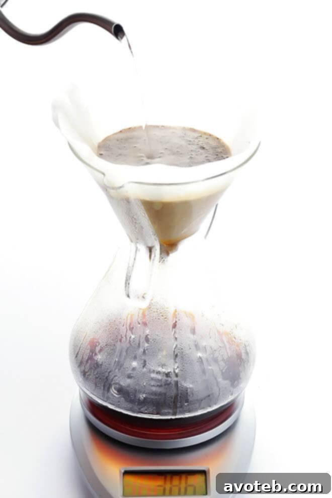 Step 3: Master the bloom and subsequent pours for even coffee extraction.