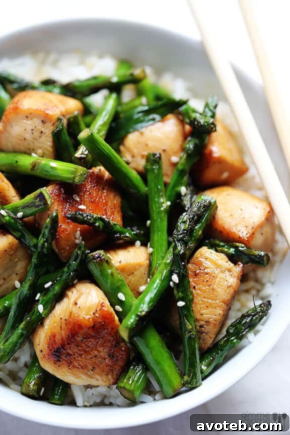 Close-up of Chicken and Asparagus Stir-Fry in a Skillet