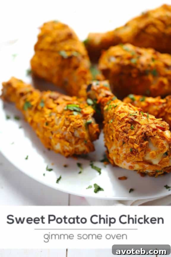 Close-up of crispy Sweet Potato Chip Chicken with fresh herbs.