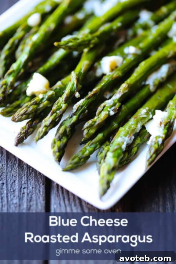 Close-up of Blue Cheese Roasted Asparagus, showcasing the melted cheese and tender green spears, ready to be served.