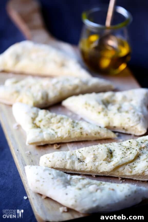 Overhead view of a finished Easy Italian Flatbread, ready to be sliced and served.