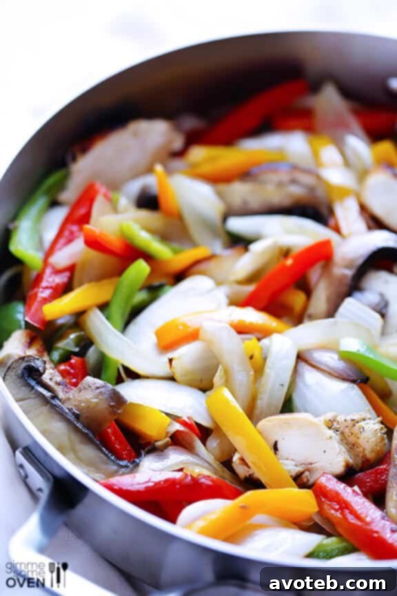 Sautéing Chicken and Vegetables for Margarita Fajitas Pan with Sliced Chicken and Vegetables for Fajitas