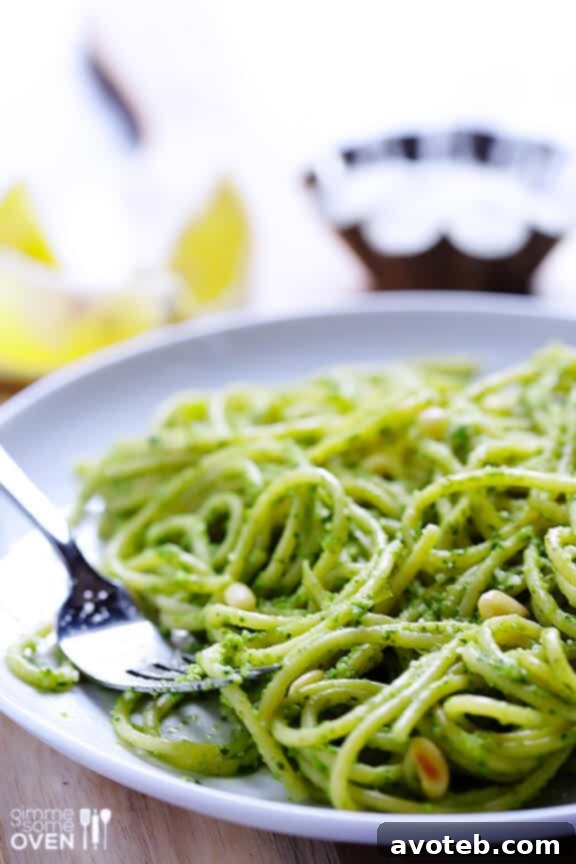 Ingredients for Arugula Pesto, including fresh arugula, garlic, and pine nuts.