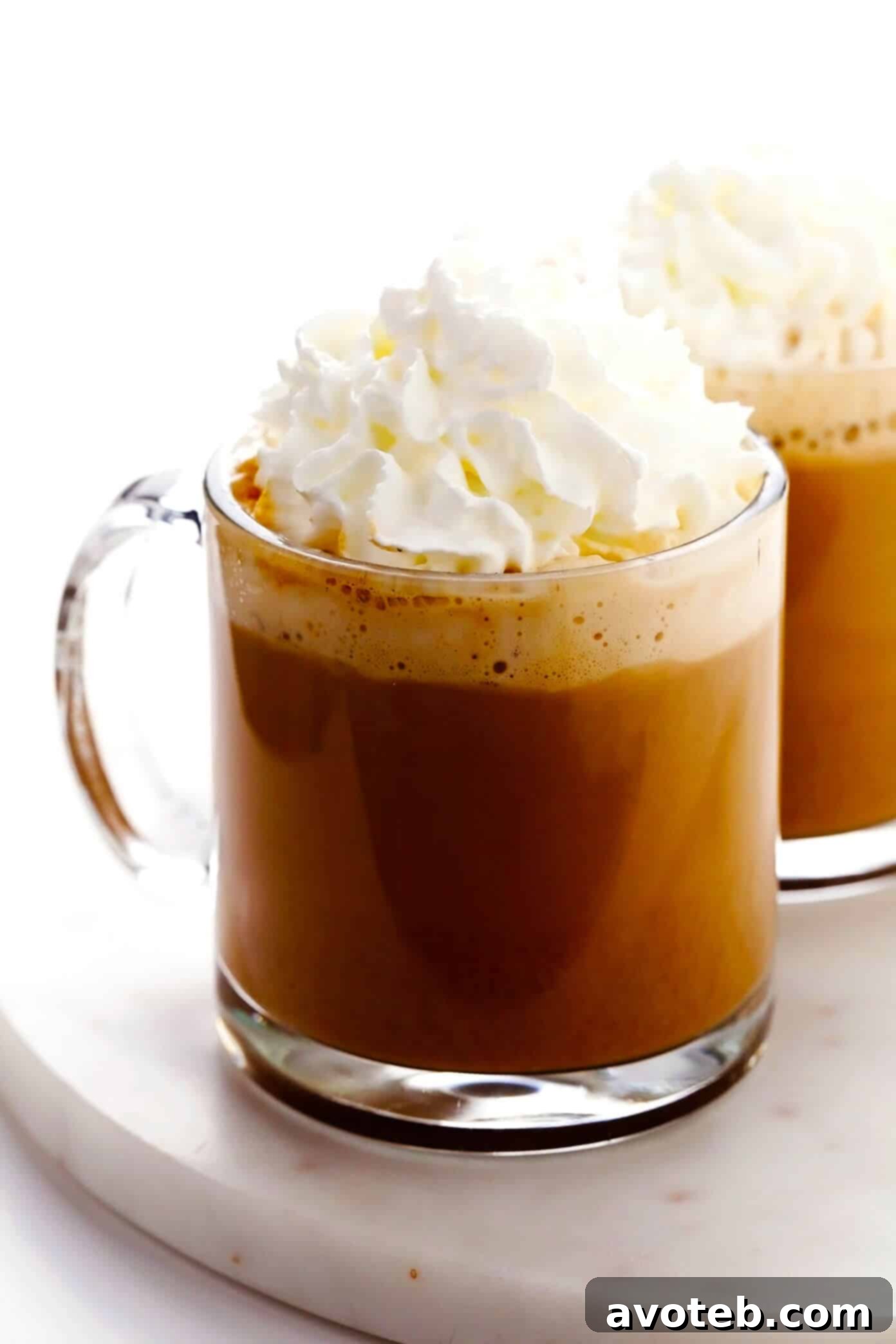 Homemade Pumpkin Spice Latte with a dollop of whipped cream and a sprinkle of spices.