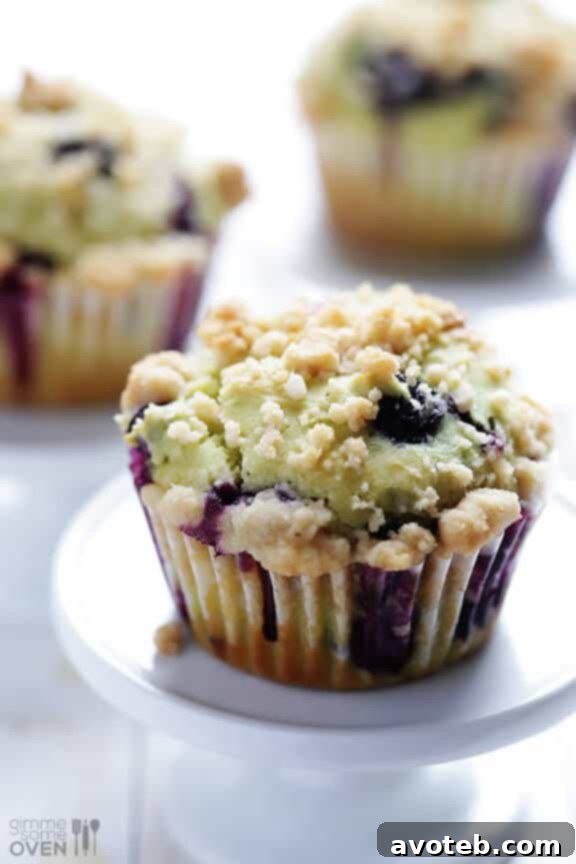 Another close-up of the delicious blueberry avocado muffins, showcasing their soft texture and the visual appeal of the blueberries.