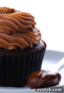 Nutella Cupcakes with generous frosting and a sprinkle of sea salt