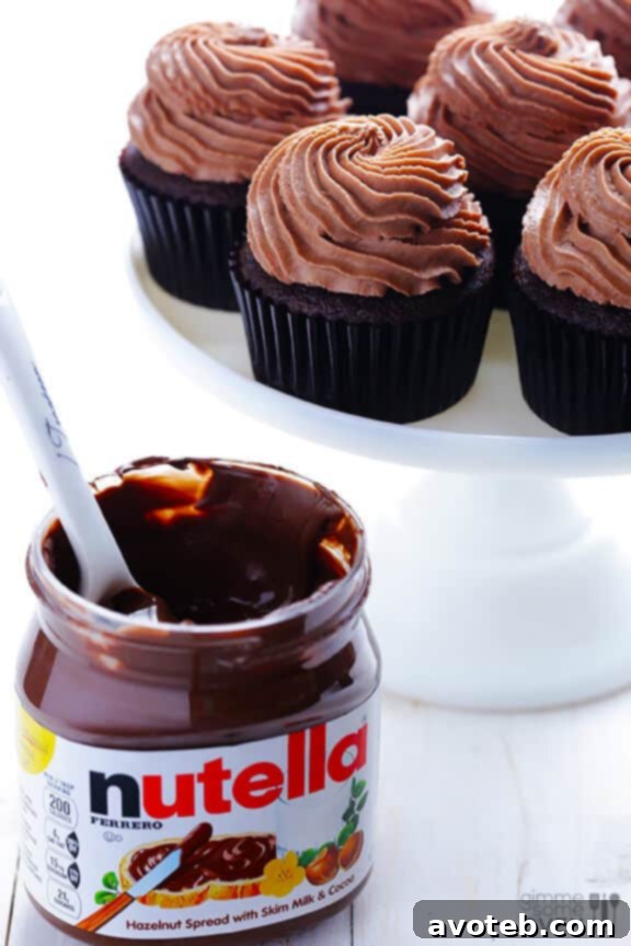 Measuring Nutella for the cupcake filling