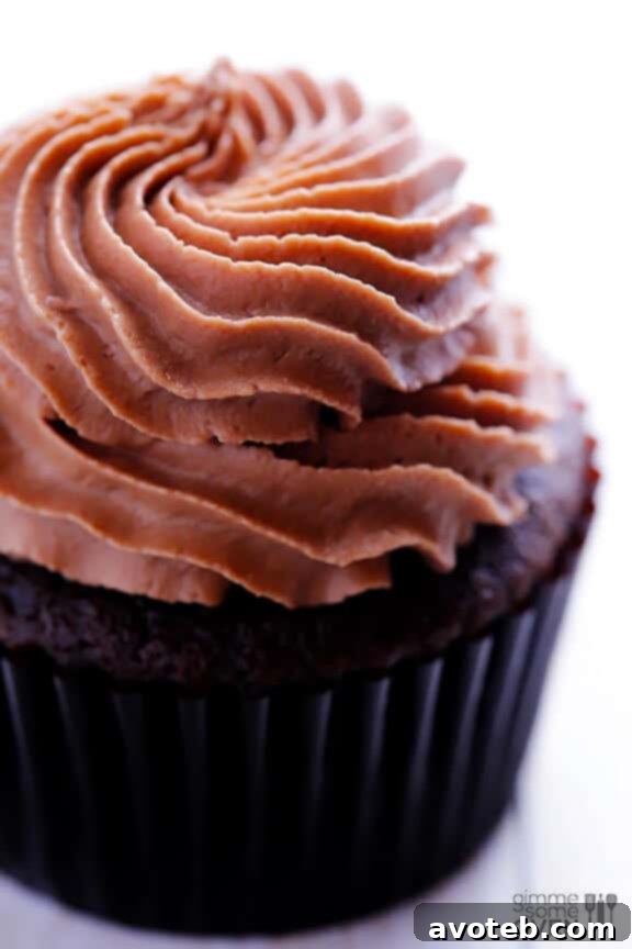 Pouring chocolate cupcake batter into liners