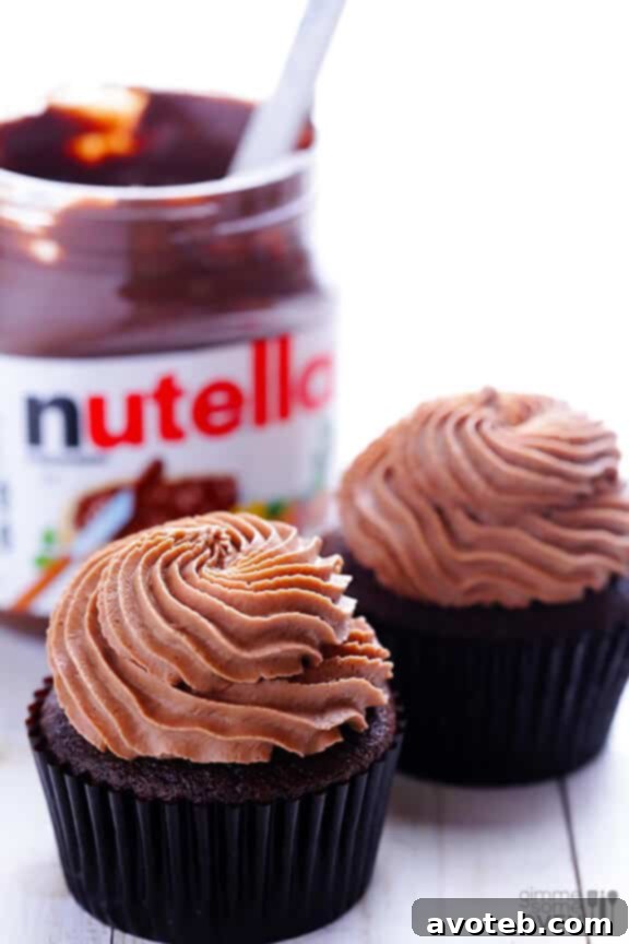 Freshly baked chocolate cupcakes cooling on a rack
