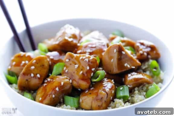 Lighter Sesame Chicken with Quinoa, a healthier alternative to traditional deep-fried sesame chicken. Served over a bed of fluffy quinoa for a complete and balanced meal.