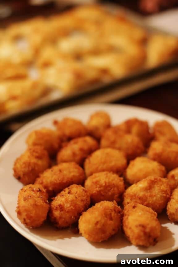 Cross-section of an Oven-Fried Spanish Croquette, showing the melted cheese and chorizo filling