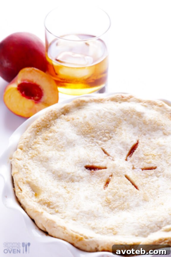 Rustic homemade Peach Bourbon Pie crust with a hint of imperfection