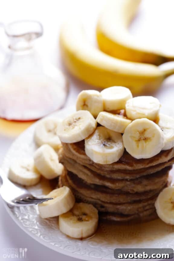 Stack of fluffy banana pancakes on a plate