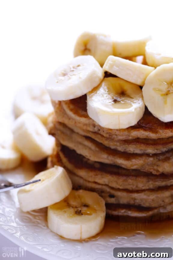 Banana pancakes drizzled generously with maple syrup