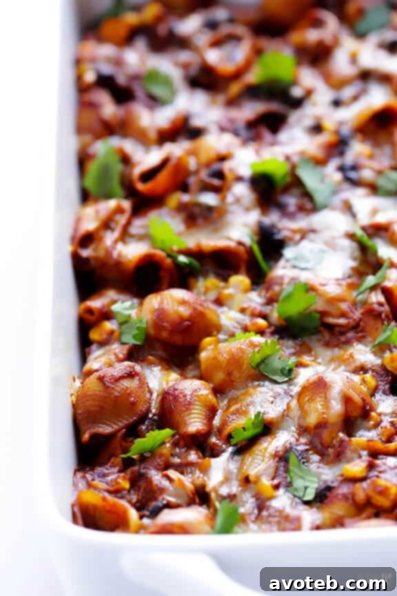 Serving of Chicken Enchilada Pasta Bake with fresh toppings