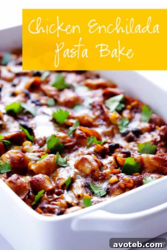 Overhead view of Chicken Enchilada Pasta Bake in a casserole dish