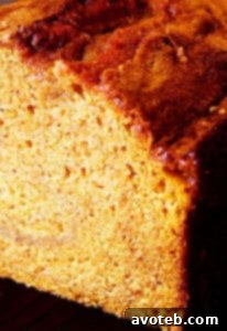 Two golden-brown loaves of classic pumpkin bread