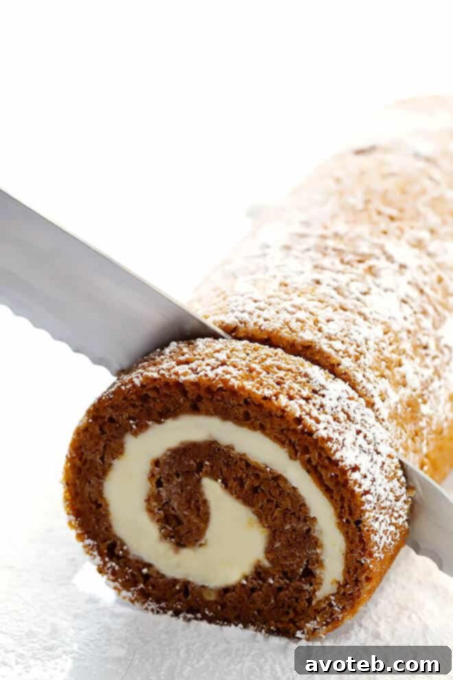 Beautifully Sliced Classic Pumpkin Roll Revealing Creamy Swirls