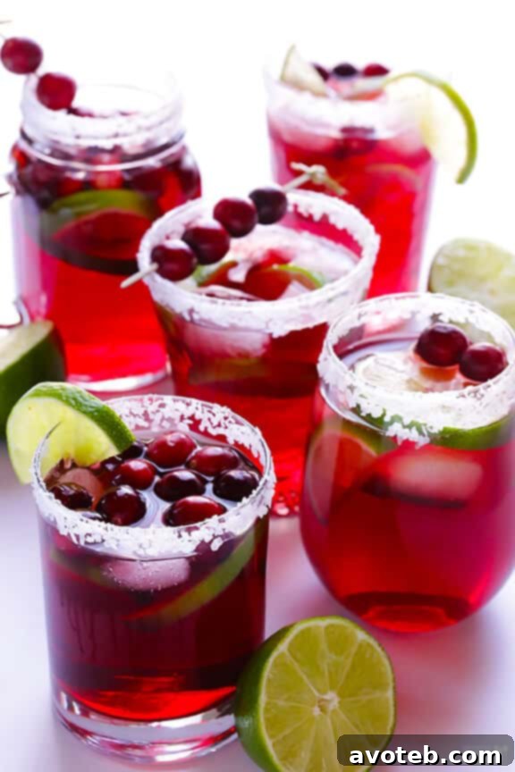 Delicious Cranberry Margaritas ready to be served, adorned with festive garnishes.
