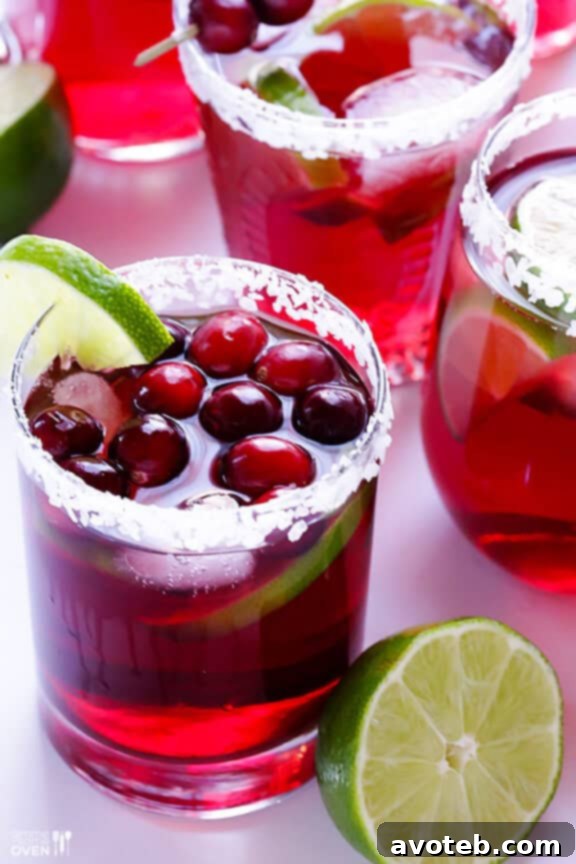 A festive spread featuring Cranberry Margaritas alongside holiday decorations, inviting celebration.