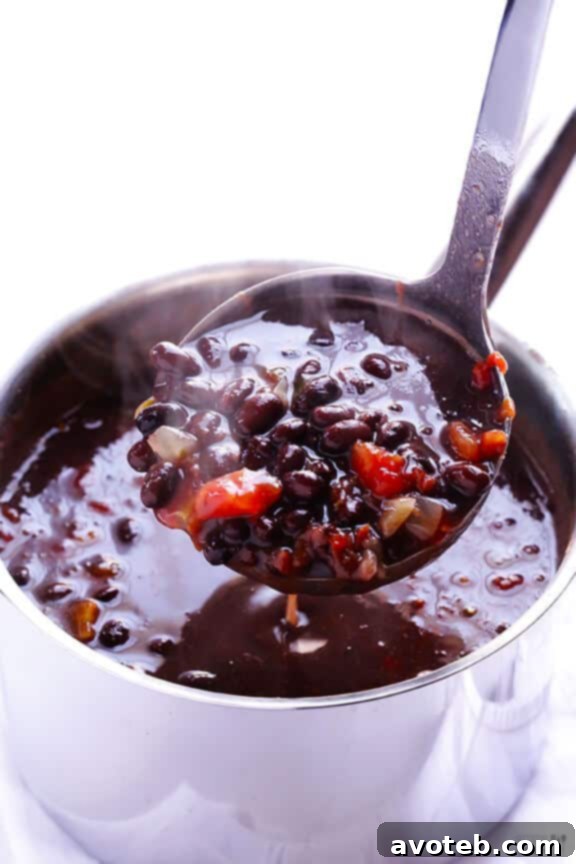 Closeup of creamy and rich 5-Ingredient Black Bean Soup with fresh cilantro garnish.