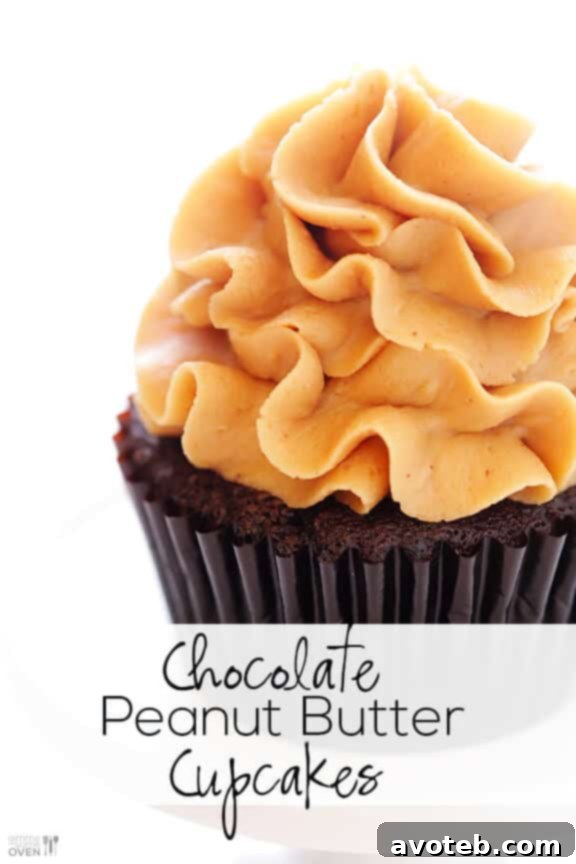 Decadent Chocolate Peanut Butter Cupcakes 6 A single Chocolate Peanut Butter Cupcake with a bite taken out, revealing the inside.
