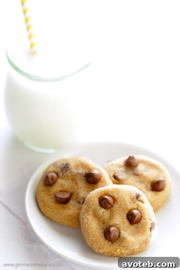 A tray of perfectly baked 4-Ingredient Peanut Butter Chocolate Chip Cookies cooling