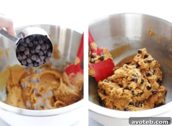 Adding chocolate chips to the peanut butter cookie dough
