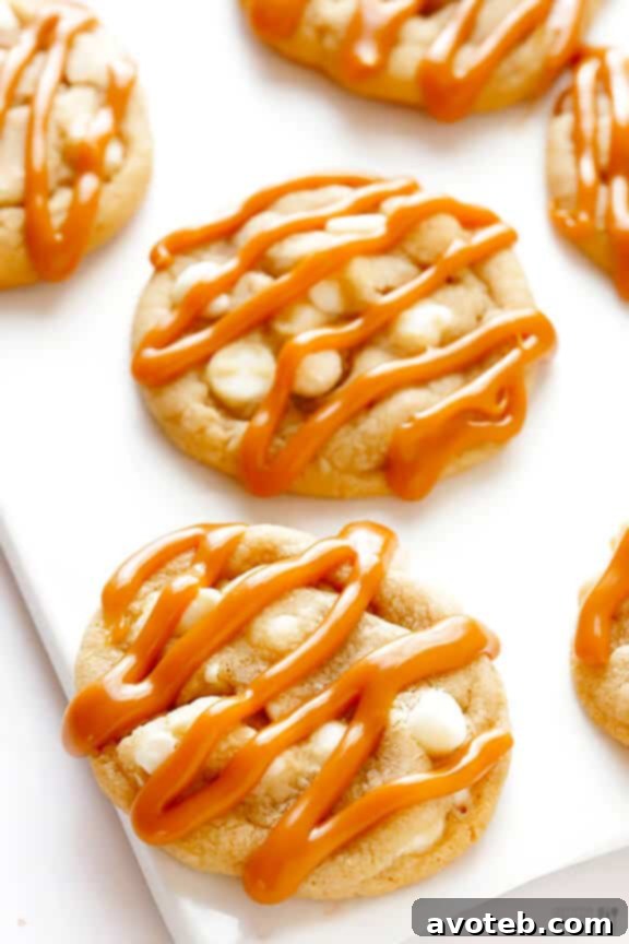 The Art of Caramel Drizzling on Cookies Close-up of golden Caramel White Chocolate Cookies with elegant caramel drizzles, highlighting their deliciousness.