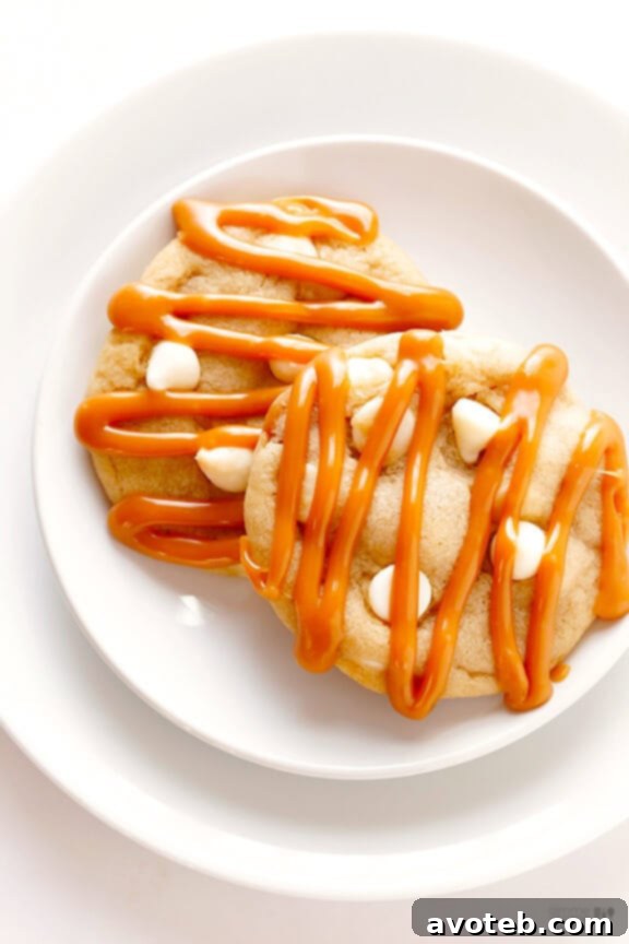 Easy Homemade Caramel White Chocolate Cookies A stack of golden Caramel White Chocolate Cookies, showcasing their delightful texture and readiness to be enjoyed.