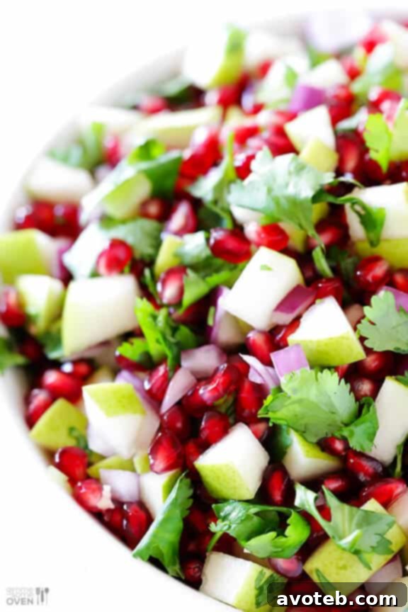 A beautifully composed bowl of 5-Ingredient Pear Pomegranate Salsa, showcasing its freshness and vibrant colors, ready for any table.