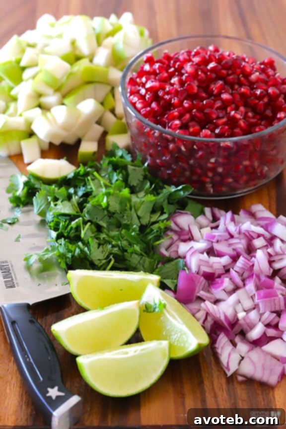 Close-up of the 5-Ingredient Pear Pomegranate Salsa, highlighting the juicy pear chunks and sparkling pomegranate seeds, expertly diced and mixed.